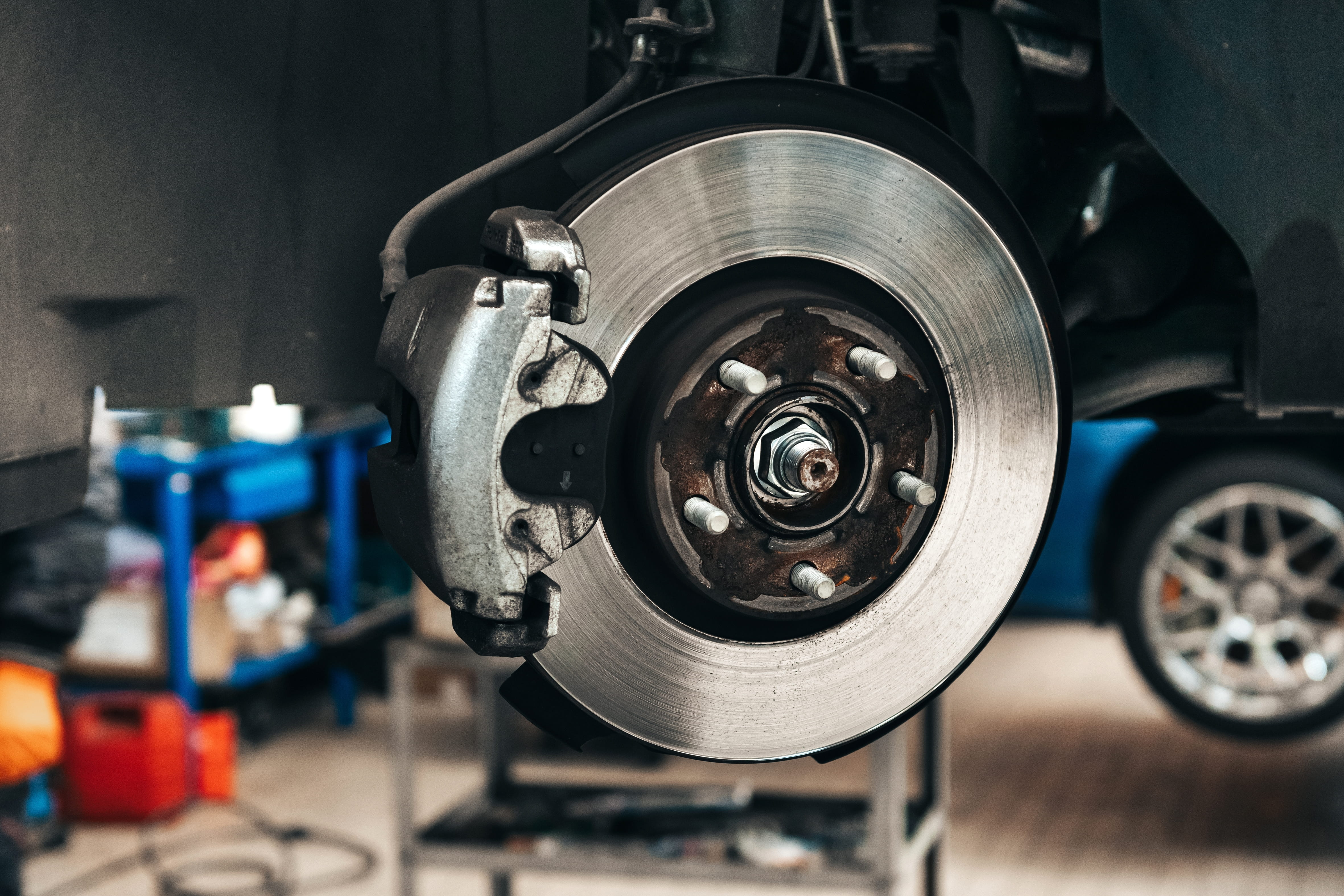 Brake repair in Edinburg, TX, by Premium Automotive. Image of a vehicle’s brake rotor and caliper, highlighting precise diagnostics, reliable stopping power, and safe driving through professional brake maintenance and repair.