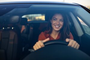 ADAS Calibration in McAllen, TX by Premium Automotive, A smiling woman driving