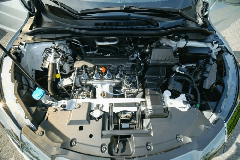 Pre-purchase car inspection in Edinburg, TX showing a technician inspecting a used vehicle engine at Premium Automotive.