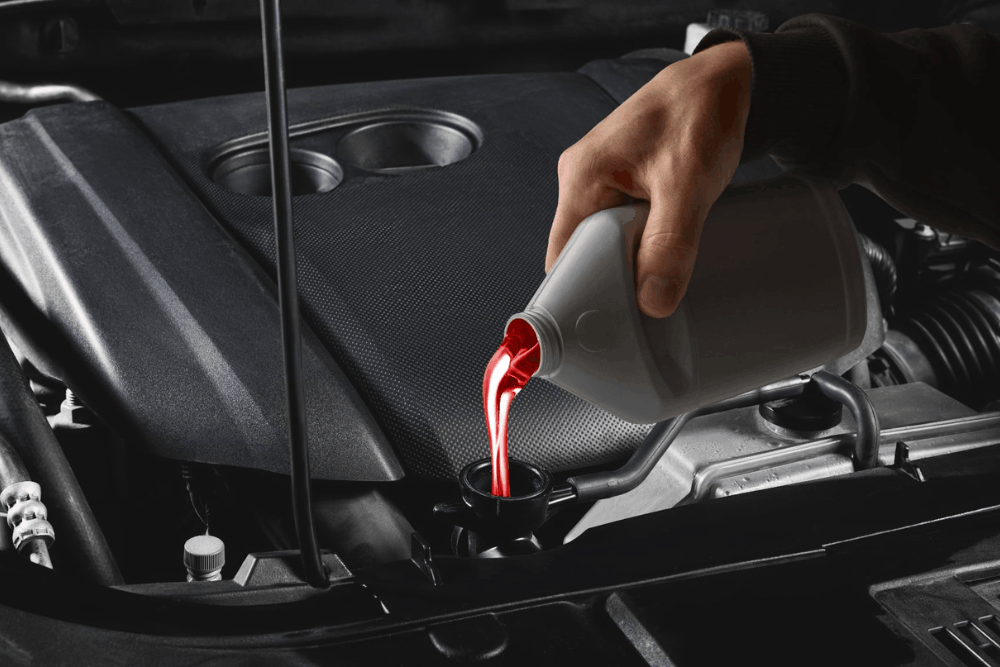 Protect Your Drivetrain: Transmission Fluid Service in McAllen - Premium Automotive - Transmission fluid being poured