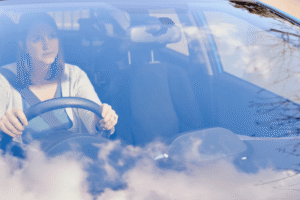 ADAS Calibration in McAllen, TX by Premium Automotive, A smiling woman driving