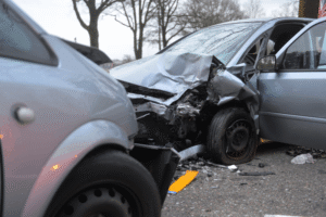 Collision repair in Harlingen, TX at Premium Collision. Image of two vehicles involved in a crash, including one with severe front-end damage, highlighting the need for professional body and structural repair.